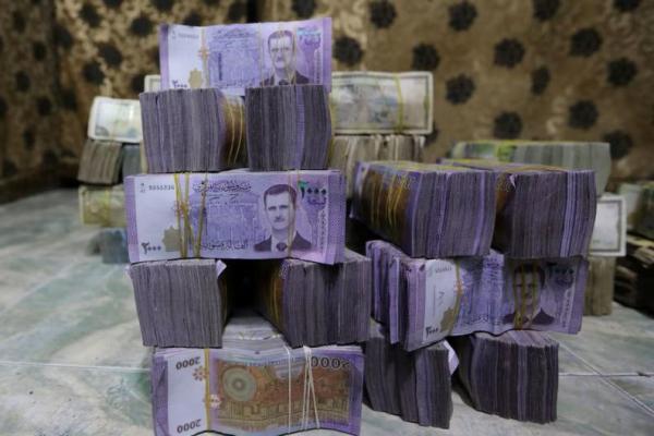 Syria to revalue currency, dropping two zeros in bid for stability, sources say